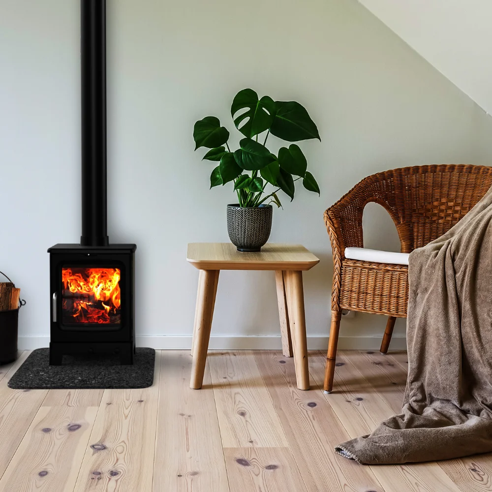 Black wood burning stove installed in a modern living room fireplace