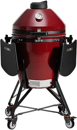 Red kamado barbecue grill on a wheeled stand
